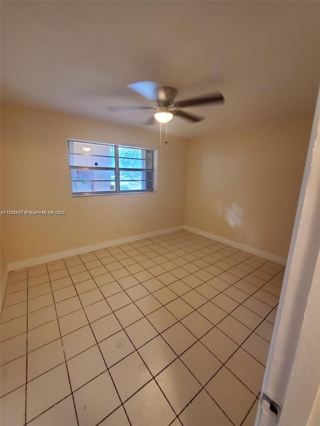 1450 NE 191st St Unit 106, Miami, FL 33179 - unfurnished room featuring light tile patterned floors and ceiling fan