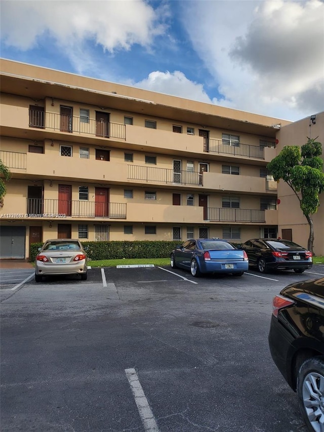 1450 NE 191st St Unit 106, Miami, FL 33179 - view of apartment building / complex with uncovered parking