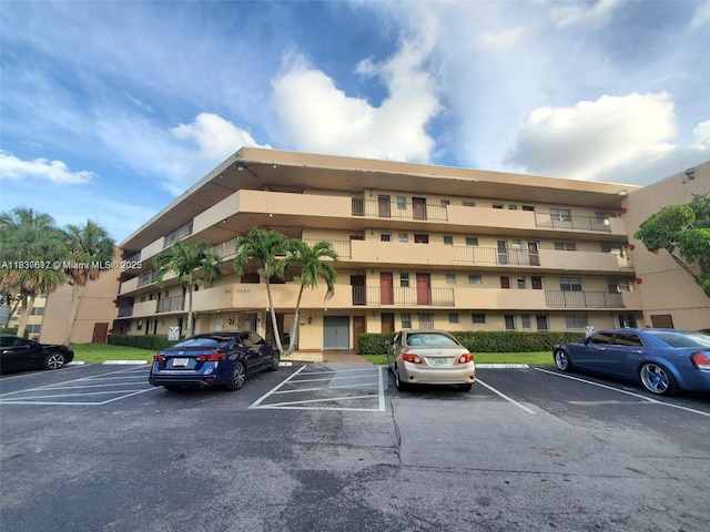 1450 NE 191st St Unit 106, Miami, FL 33179 - view of apartment building / complex with uncovered parking