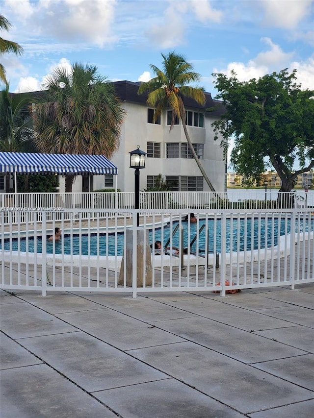 1450 NE 191st St Unit 106, Miami, FL 33179 - community pool featuring a patio