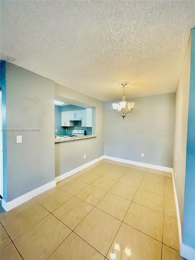 1231 SW 46th Ave Unit 507, Pompano Beach, FL 33069 - empty room with a chandelier and light tile patterned floors