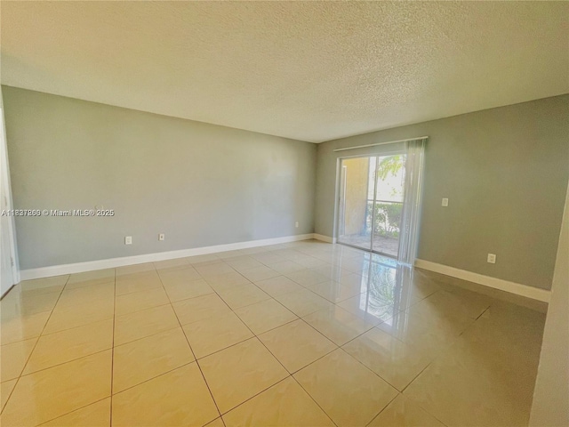 1231 SW 46th Ave Unit 507, Pompano Beach, FL 33069 - empty room with light tile patterned floors and a textured ceiling