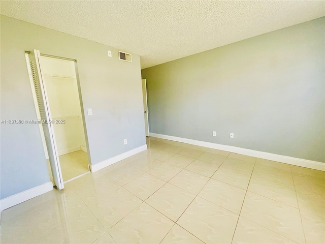 1231 SW 46th Ave Unit 507, Pompano Beach, FL 33069 - unfurnished room with a textured ceiling and light tile patterned floors