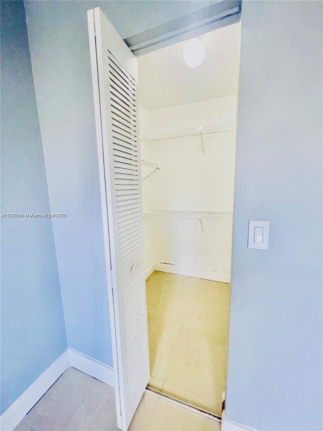 1231 SW 46th Ave Unit 507, Pompano Beach, FL 33069 - spacious closet featuring tile patterned flooring
