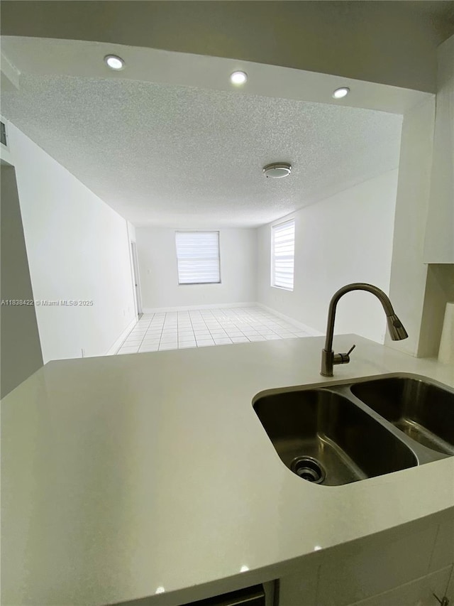 5705 W 20th Ave Unit 115, Hialeah, FL 33012 - kitchen featuring light tile patterned floors, a textured ceiling, and recessed lighting