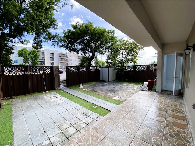 5705 W 20th Ave Unit 115, Hialeah, FL 33012 - fenced backyard with a patio area