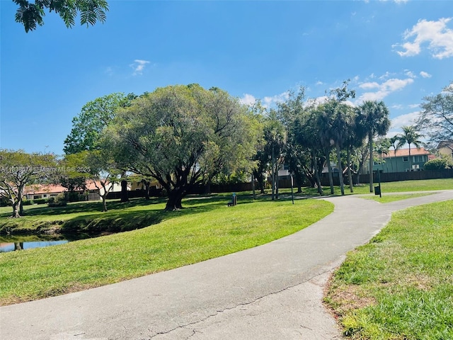 10670 SW 156th Pl Unit 304, Miami, FL 33196 - surrounding community featuring a lawn