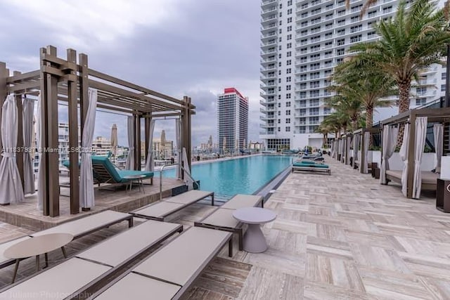 4010 S Ocean Dr Unit T3501, Hollywood, FL 33019 - community pool featuring a pergola, a patio, and a city view