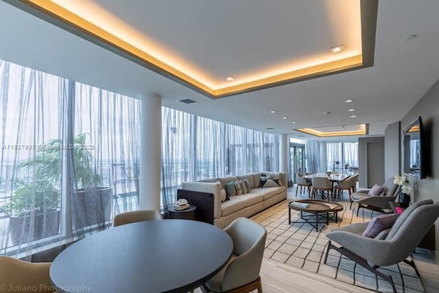 4010 S Ocean Dr Unit T3501, Hollywood, FL 33019 - living area featuring a tray ceiling and plenty of natural light
