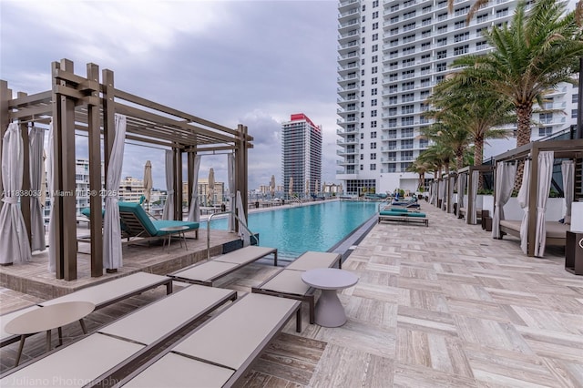 4010 S Ocean Dr Unit R409, Hollywood, FL 33019 - community pool featuring a pergola and a city view