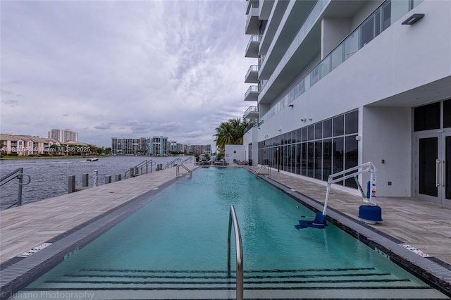 4010 S Ocean Dr Unit R409, Hollywood, FL 33019 - community pool featuring a water view, a patio, and french doors
