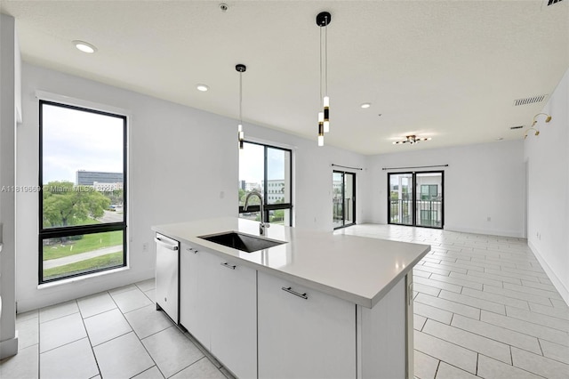 8167 NW 41st St Unit E-406, Doral, FL 33166 - kitchen featuring open floor plan, dishwasher, plenty of natural light, a center island with sink, and recessed lighting