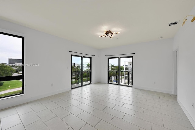 8167 NW 41st St Unit E-406, Doral, FL 33166 - unfurnished room with light tile patterned flooring and baseboards