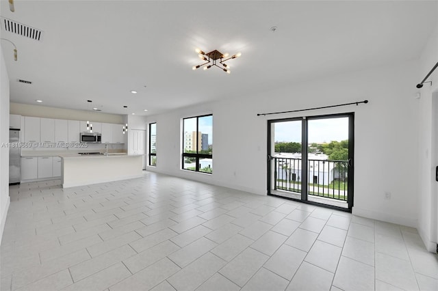 8167 NW 41st St Unit E-406, Doral, FL 33166 - unfurnished living room featuring recessed lighting and light tile patterned flooring