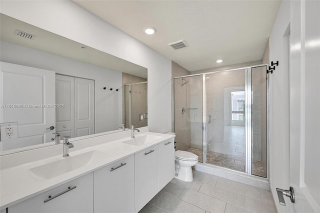 8167 NW 41st St Unit E-406, Doral, FL 33166 - bathroom featuring tile patterned flooring, double vanity, a shower stall, and recessed lighting