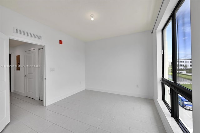 8167 NW 41st St Unit E-406, Doral, FL 33166 - unfurnished room with light tile patterned floors and baseboards