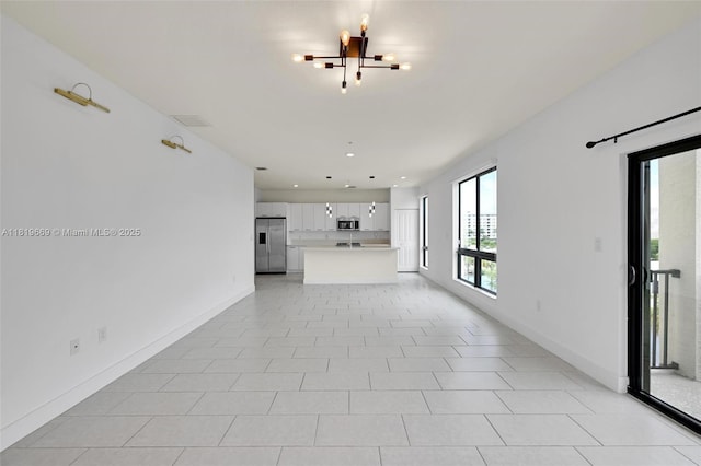 8167 NW 41st St Unit E-406, Doral, FL 33166 - unfurnished living room with recessed lighting and a chandelier