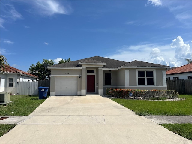 15924 SW 306th Ter, Homestead, FL 33033 - view of front of property with stucco siding, an attached garage, driveway, and roof with shingles