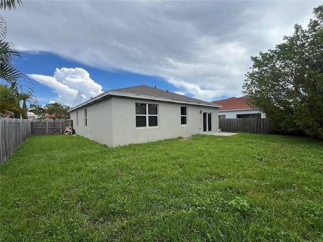 15924 SW 306th Ter, Homestead, FL 33033 - back of property featuring a fenced backyard and stucco siding
