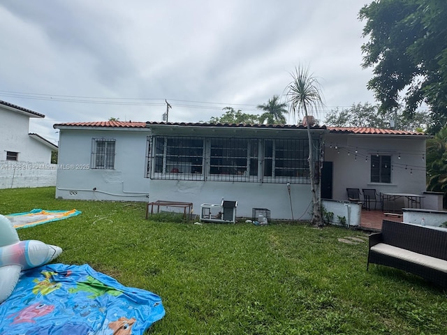 141 SW 20th Rd, Miami, FL 33129 - rear view of house with stucco siding