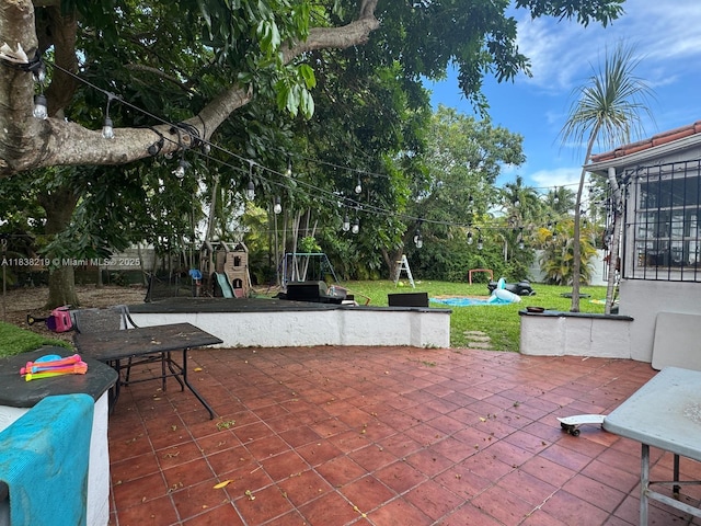 141 SW 20th Rd, Miami, FL 33129 - view of patio / terrace featuring a playground