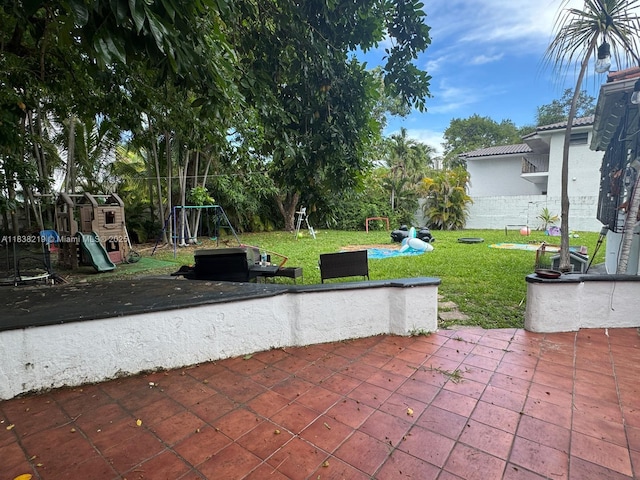 141 SW 20th Rd, Miami, FL 33129 - view of patio / terrace featuring a playground