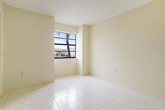 5808 W 26th Ave Unit 211, Hialeah, FL 33016 - empty room with a textured ceiling and light tile patterned floors