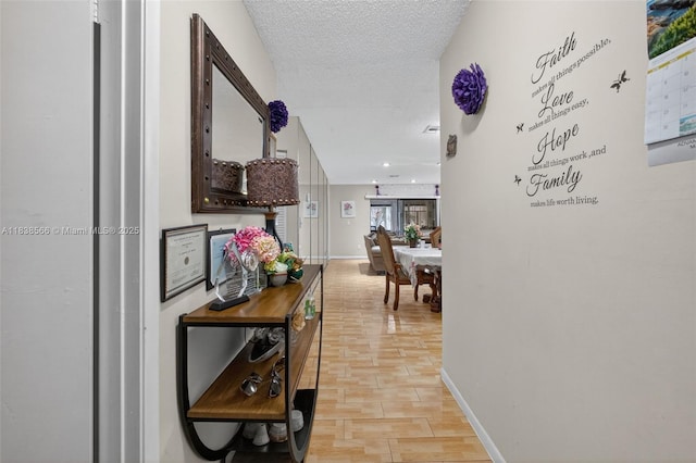 1600 Granfern Ave, West Palm Beach, FL 33415 - hallway with light wood-type flooring and a textured ceiling
