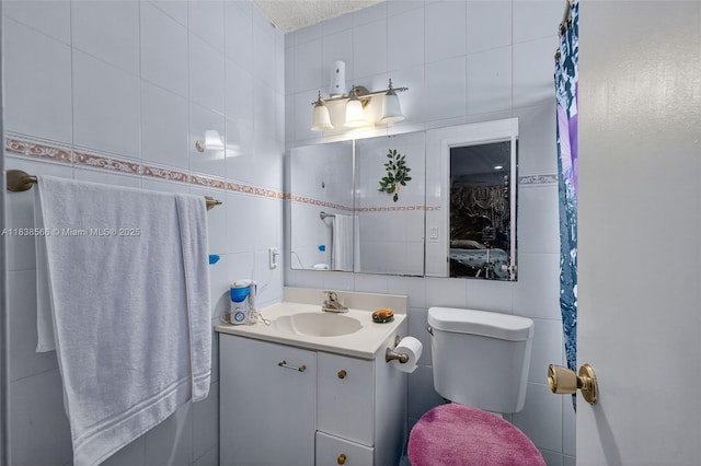 1600 Granfern Ave, West Palm Beach, FL 33415 - bathroom featuring tile walls, vanity, and backsplash