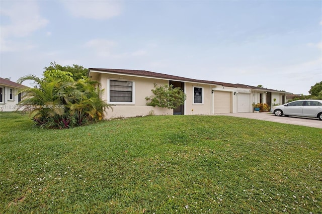 1600 Granfern Ave, West Palm Beach, FL 33415 - ranch-style house featuring a garage, driveway, stucco siding, and a front lawn