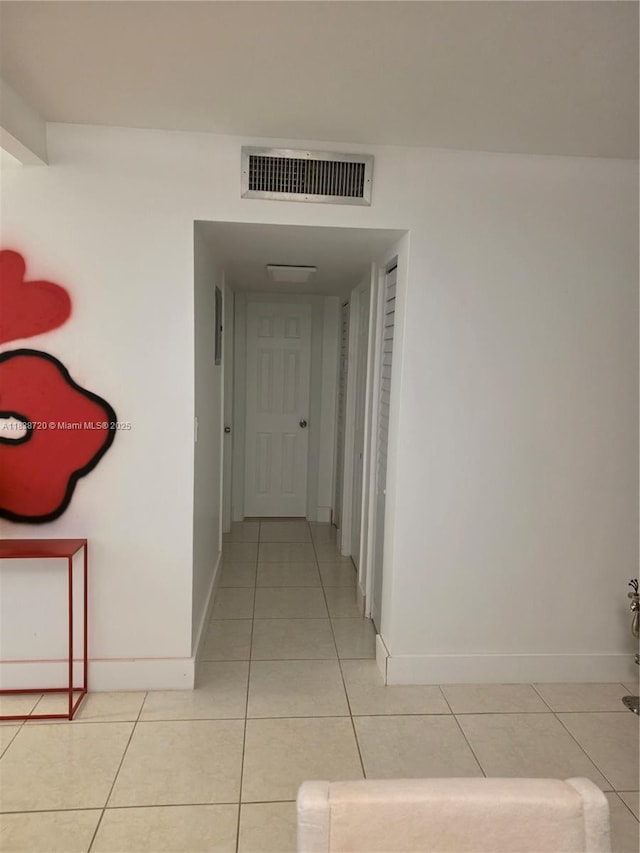 620 NE 12th Ave Unit 101, Hallandale Beach, FL 33009 - hall with light tile patterned floors and baseboards