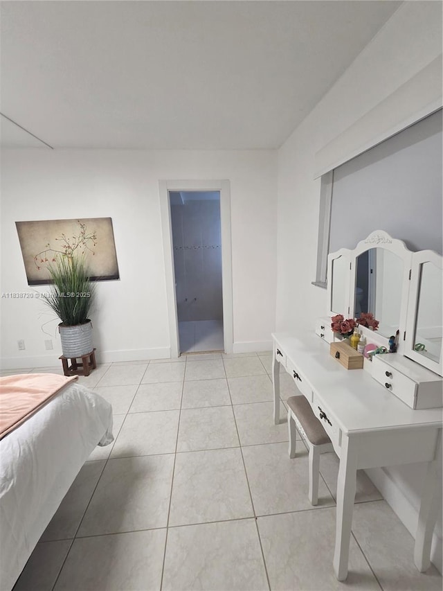 620 NE 12th Ave Unit 101, Hallandale Beach, FL 33009 - bedroom featuring baseboards and light tile patterned floors