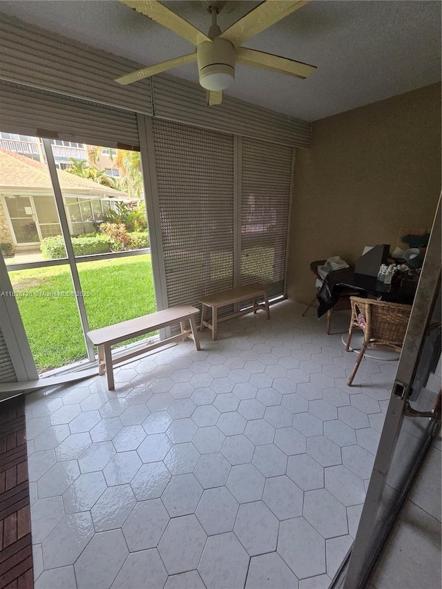 620 NE 12th Ave Unit 101, Hallandale Beach, FL 33009 - unfurnished sunroom featuring a ceiling fan