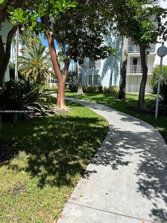498 NW 165th St Rd Unit D-407, Miami, FL 33169 - surrounding community with a yard