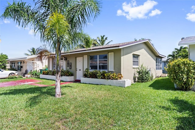 4938 NW 54th Ct, Tamarac, FL 33319 - single story home featuring stucco siding and a front yard