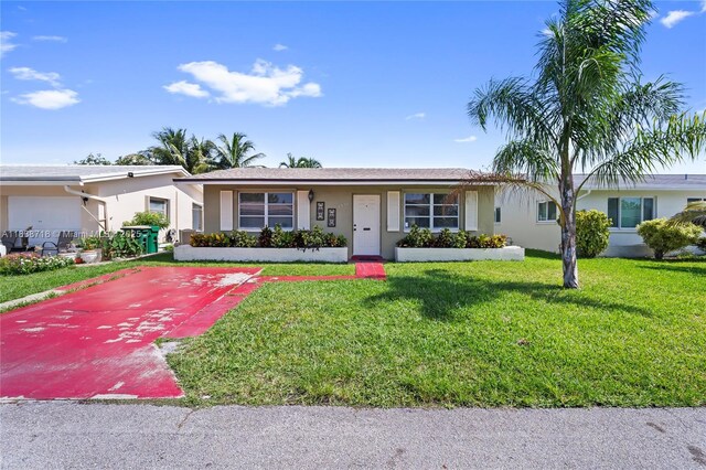 4938 NW 54th Ct, Tamarac, FL 33319 - ranch-style house with stucco siding and a front yard
