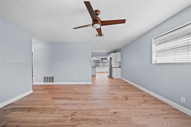4938 NW 54th Ct, Tamarac, FL 33319 - unfurnished living room with ceiling fan and light wood-style floors