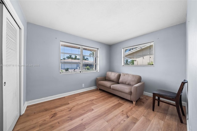 4938 NW 54th Ct, Tamarac, FL 33319 - living area featuring light wood-type flooring and baseboards