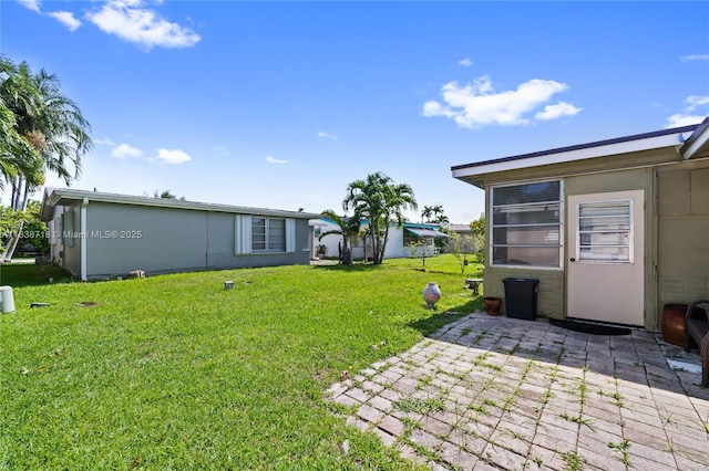 4938 NW 54th Ct, Tamarac, FL 33319 - view of green lawn with a patio