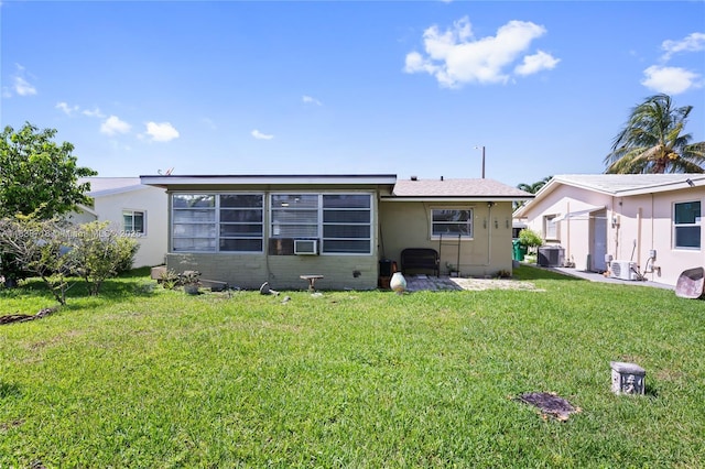 4938 NW 54th Ct, Tamarac, FL 33319 - rear view of house featuring a lawn, stucco siding, and cooling unit