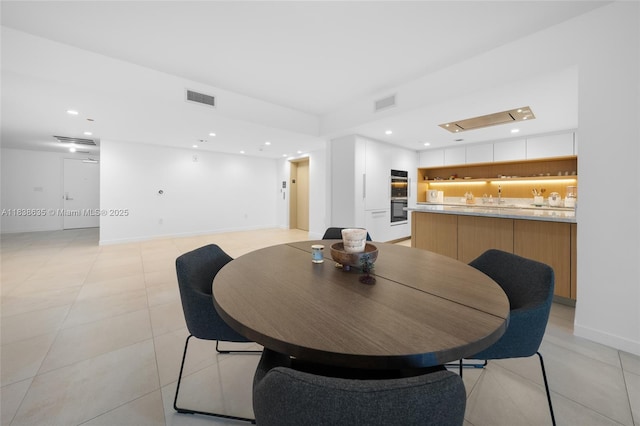 1135 103rd St Unit 702, Bay Harbor Islands, FL 33154 - dining space with light tile patterned floors and recessed lighting