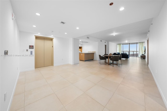 1135 103rd St Unit 702, Bay Harbor Islands, FL 33154 - living room with elevator, recessed lighting, and light tile patterned flooring