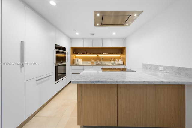 1135 103rd St Unit 702, Bay Harbor Islands, FL 33154 - kitchen with recessed lighting, a peninsula, black electric stovetop, white cabinetry, and light tile patterned flooring