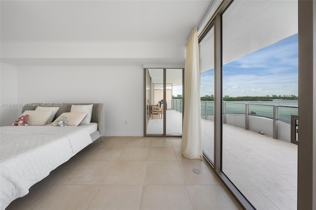 1135 103rd St Unit 702, Bay Harbor Islands, FL 33154 - bedroom with access to exterior and baseboards
