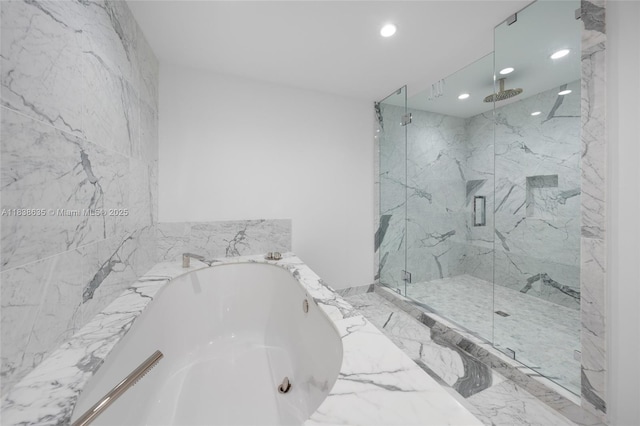 1135 103rd St Unit 702, Bay Harbor Islands, FL 33154 - bathroom with a marble finish shower, a garden tub, and recessed lighting