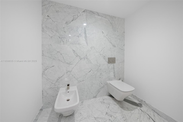 1135 103rd St Unit 702, Bay Harbor Islands, FL 33154 - bathroom with a bidet and marble finish flooring