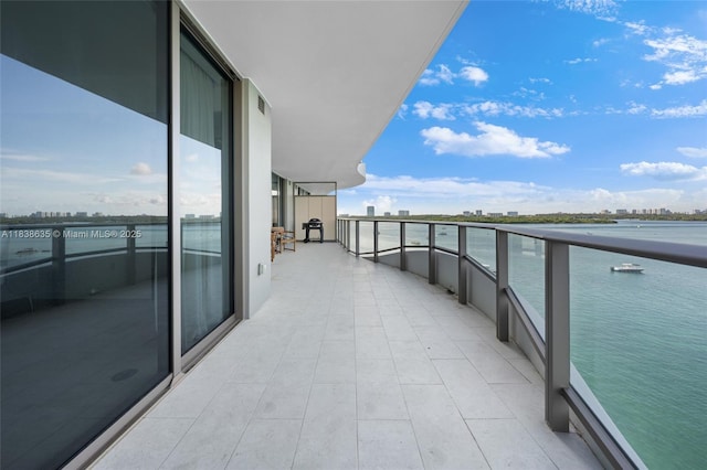 1135 103rd St Unit 702, Bay Harbor Islands, FL 33154 - balcony with a water view and a view of city