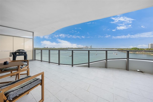 1135 103rd St Unit 702, Bay Harbor Islands, FL 33154 - balcony with a water view and a sunroom