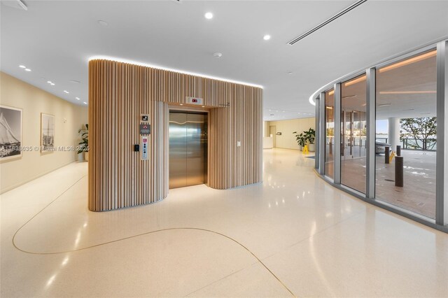 1135 103rd St Unit 702, Bay Harbor Islands, FL 33154 - lobby featuring floor to ceiling windows and recessed lighting