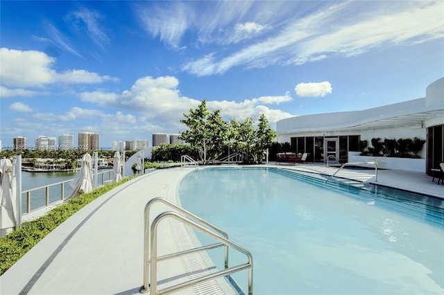 1135 103rd St Unit 702, Bay Harbor Islands, FL 33154 - community pool featuring a water view and a view of city